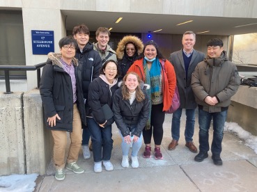 Photo of lab members outside 17 Hillhouse