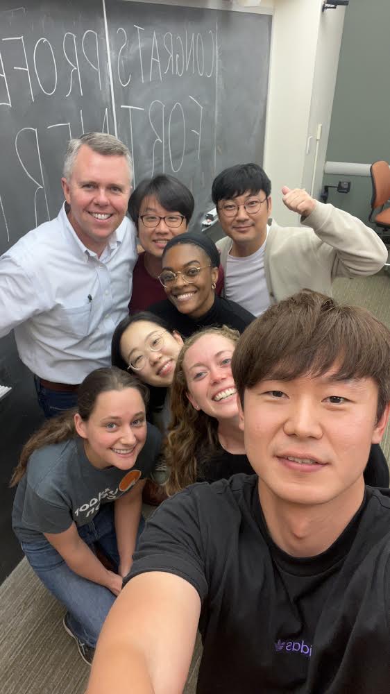 Lab members smile for selfie